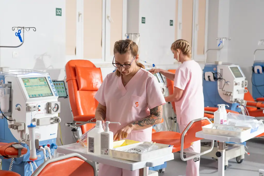Diaverum nurses preparing dialysis equipment in a modern renal care clinic