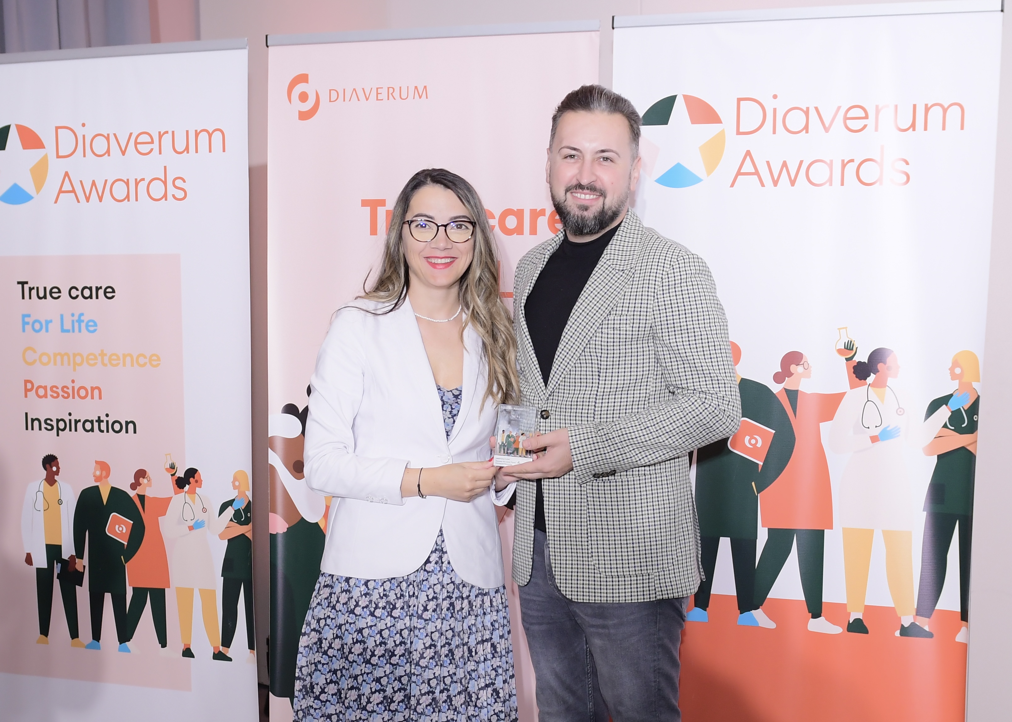 Diaverum Romania representatives accepting their team's award.jpg