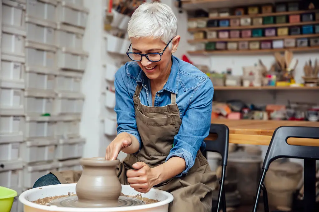 Elderly female working on potter